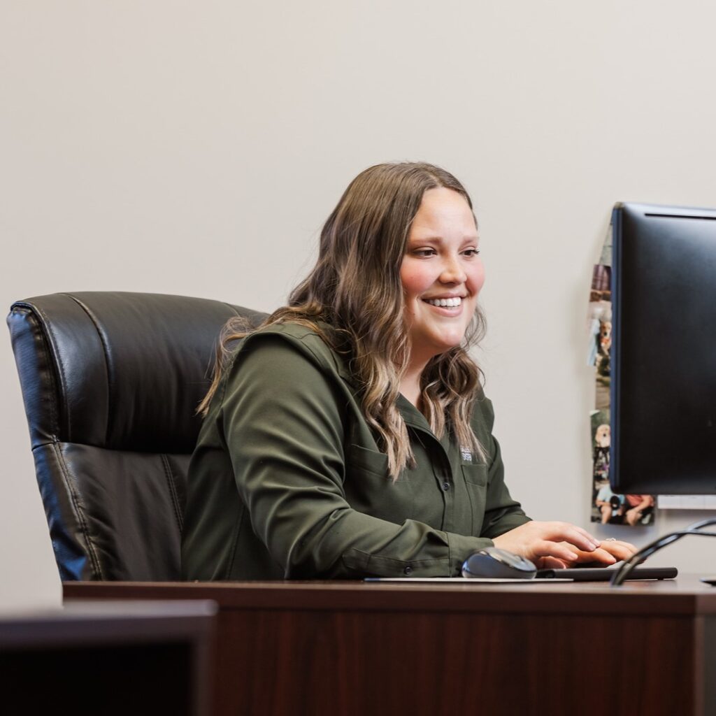 A saltech employee working at her desk