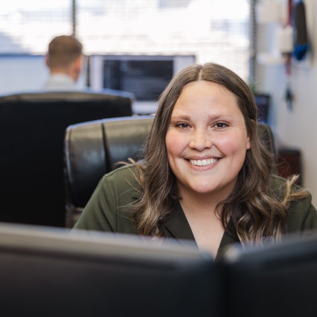 A saltech employee working at her desk