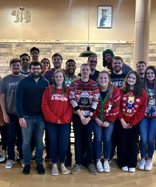 Saltech employees posing for a group picture at Inside Golf and Axe for a holiday party